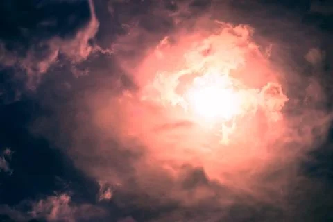 Dark sky with sun Stock Photos