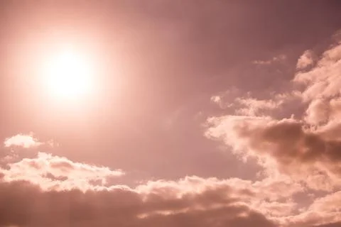 Dark sky with sun Stock Photos