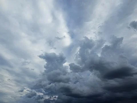 Dark sky before thunderstorm and dramatic black cloud before rain Stock Photos