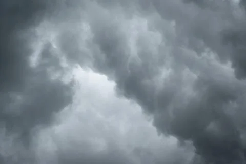 Dark sky with thunderstorm while raining. Dramatic black clouds before the .. Stock Photos