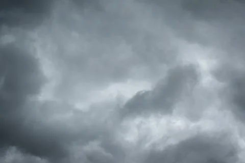 Dark sky with thunderstorm while raining. Dramatic black clouds before the .. Stock Photos