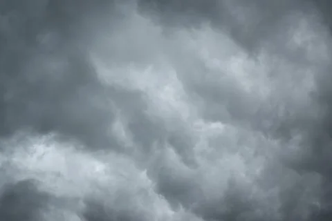 Dark sky with thunderstorm while raining. Dramatic black clouds before the .. Stock Photos