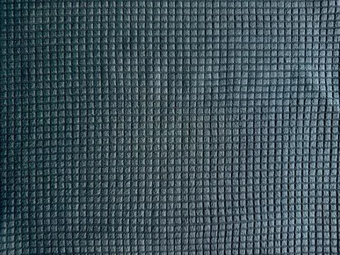 Dark slate blue waffle texture fabric background showcases a precise tactile  Stock Photos