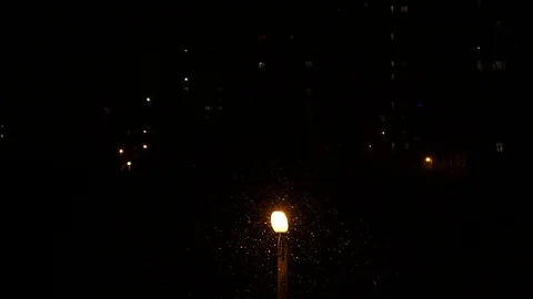 In dark snow fall street light bulb light in night rain weather abstract Stock Footage 105204319
