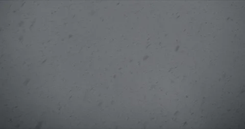 Dark snowfall on a dark background Stock Footage 128424981