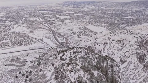 Dark Snowy Mountain Cliff Looking Down to Valley Below Wasatch Mountains Stock Footage 261661443