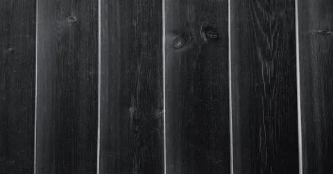 Dark soft wood surface as background, wood texture. Wood planks. Stock Photos