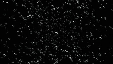 Dark space is filled with bubbles that are approaching and slowly float out of Stock Footage 126000237
