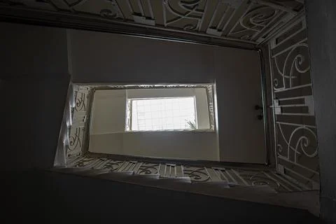 Dark staircase of an old multi-storey residential building Stock Photos