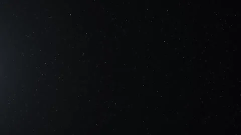 Dark starry background with subtle scattered particles, creating a calm deep Stockbeeldmateriaal 331513597