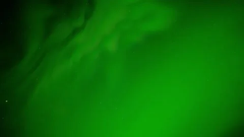 Dark starry night with sky filled with bright green Aurora Northern Lights Stock Footage 310744092