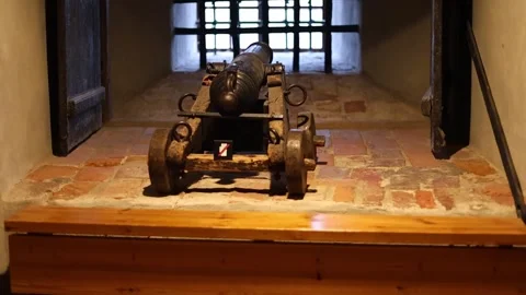 Dark stone prison inside a medieval castle, rusty bars, chains, 4K ultra HD. Stock Footage 321152802