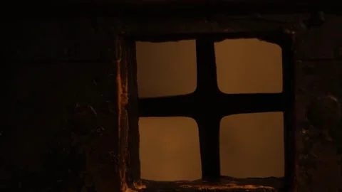 Dark stone prison inside a medieval castle, rusty bars, chains, 4K ultra HD. Stock Footage 321152932