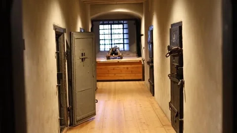 Dark stone prison inside a medieval castle, rusty bars, chains, 4K ultra HD. Stock Footage 321153210