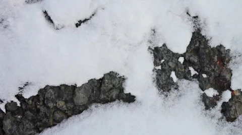 Dark stone surface covered with snow close-up Stock Footage 36363599