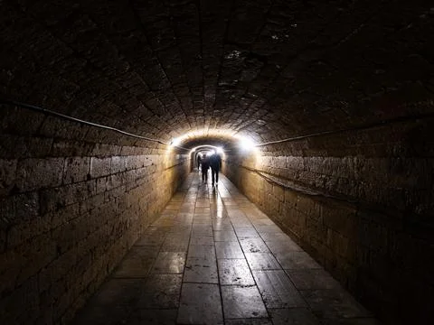 Dark stone underground passage Stock Photos