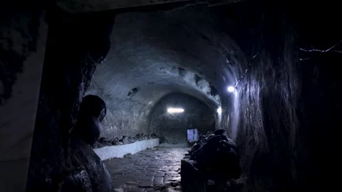 A dark storage room for ancient clay pots that hold olive oil to light Stock Footage 281269592