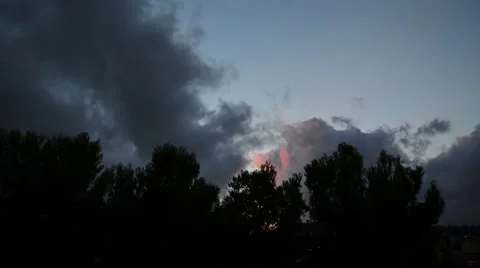 Dark storm avobe the trees during sunset 03 Stock Footage 29996535