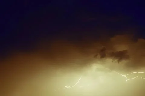 Dark storm cloud with bright lightning in the sky Stock Photos