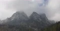 Dark Storm Cloud Mountain Rock Peak Establishing Shot Winter Season Cold Weather 4k or 4k+ Resolution
