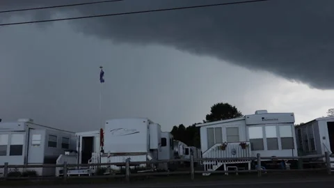 A dark storm cloud moves above a campground. Stock Footage 148039586