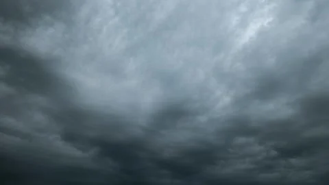 Dark storm clouds approaching rapidly in overcast sky Stock Footage 340403285