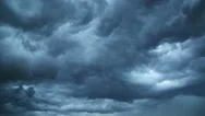 Dark Storm Clouds Are Moving Fast At Viewer - Timelapse Stock Footage