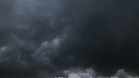 Dark storm clouds with background,Dark clouds before a thunder-storm. Video stock 233586833