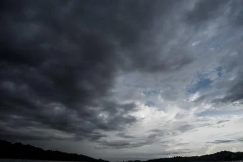 Dark storm clouds with background,Dark clouds before a thunder-storm. 库存照片