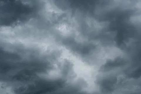 Dark storm clouds with background,Dark clouds before a thunder-storm. 写真素材