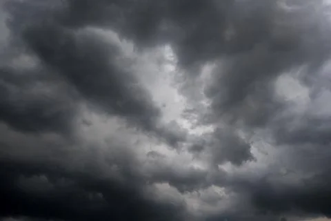 Dark storm clouds with background,Dark clouds before a thunder-storm. 库存照片