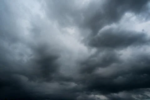 Dark storm clouds with background,Dark clouds before a thunder-storm. 库存照片