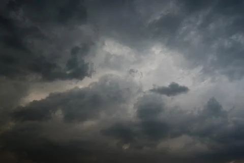 Dark storm clouds with background,Dark clouds before a thunder-storm. 库存照片