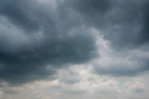 Dark storm clouds with background,Dark clouds before a thunder-storm. Stock Photos