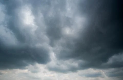 Dark storm clouds with background,Dark clouds before a thunder-storm. Stockfoto's