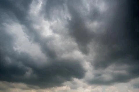 Dark storm clouds with background,Dark clouds before a thunder-storm. Stock Photos