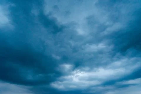Dark storm clouds with background,Dark clouds before a thunder-storm. Stockfoto's