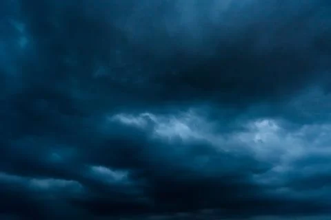 Dark storm clouds with background,Dark clouds before a thunder-storm. Stock Photos