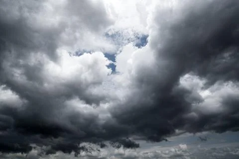 Dark storm clouds with background,Dark clouds before a thunder-storm. Stockfoto's