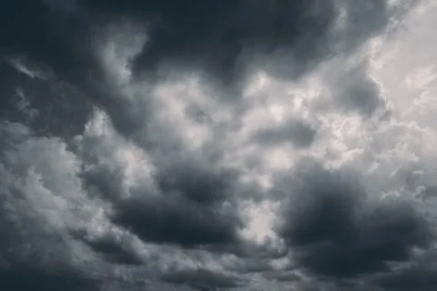 Dark storm clouds with background,Dark clouds before a thunder-storm. 写真素材