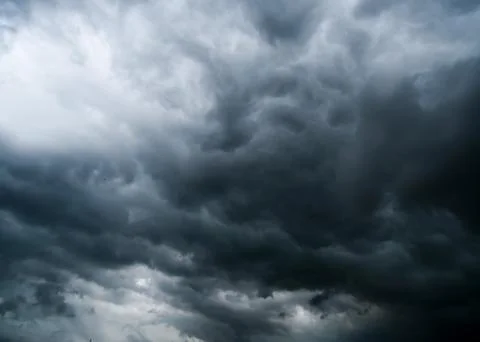 Dark storm clouds with background,Dark clouds before a thunder-storm. 库存照片