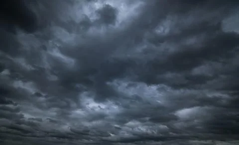 Dark storm clouds with background,Dark clouds before a thunder-storm. Stock Photos