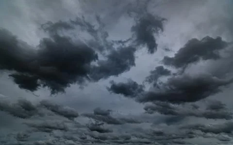 Dark storm clouds with background,Dark clouds before a thunder-storm. Stock Photos