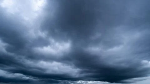 Dark storm clouds with background,Dark clouds before a thunder-storm. 写真素材