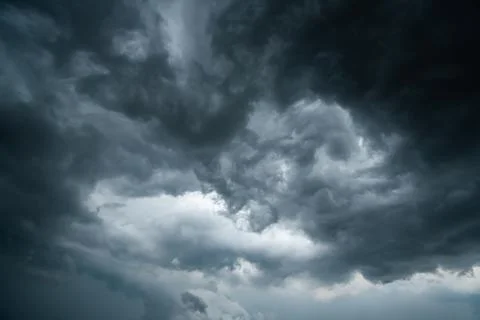 Dark storm clouds with background,Dark clouds before a thunder-storm. Stock Photos