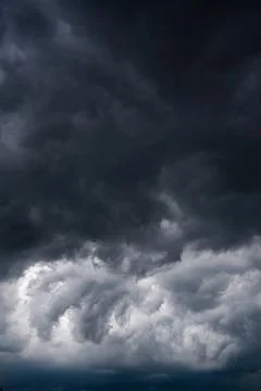 Dark storm clouds with background,Dark clouds before a thunder-storm. Stock Photos