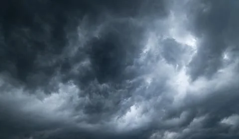 Dark storm clouds with background,Dark clouds before a thunder-storm. Stock Photos