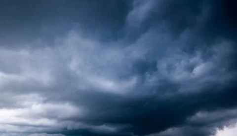 Dark storm clouds with background,Dark clouds before a thunder-storm. Stock Photos