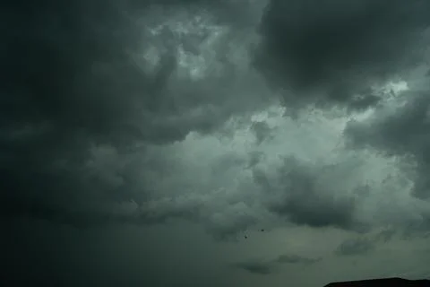 Dark storm clouds with background,Dark clouds before a thunder-storm. Stock Photos