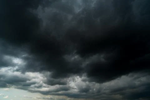 Dark storm clouds with background,Dark clouds before a thunder-storm. Photos